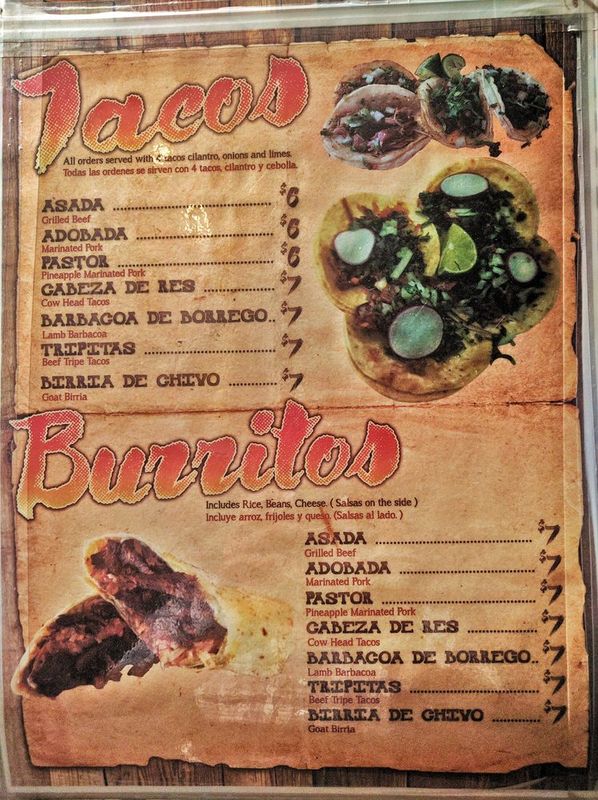 The Taco Bus menu board showing tacos and burritos with prices.