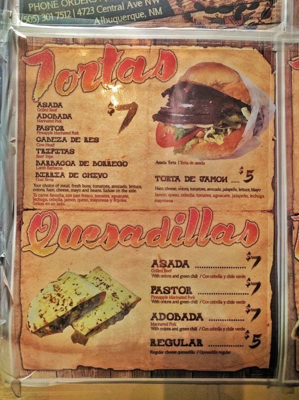 The Taco Bus menu board showing tortas and quesadillas with prices.